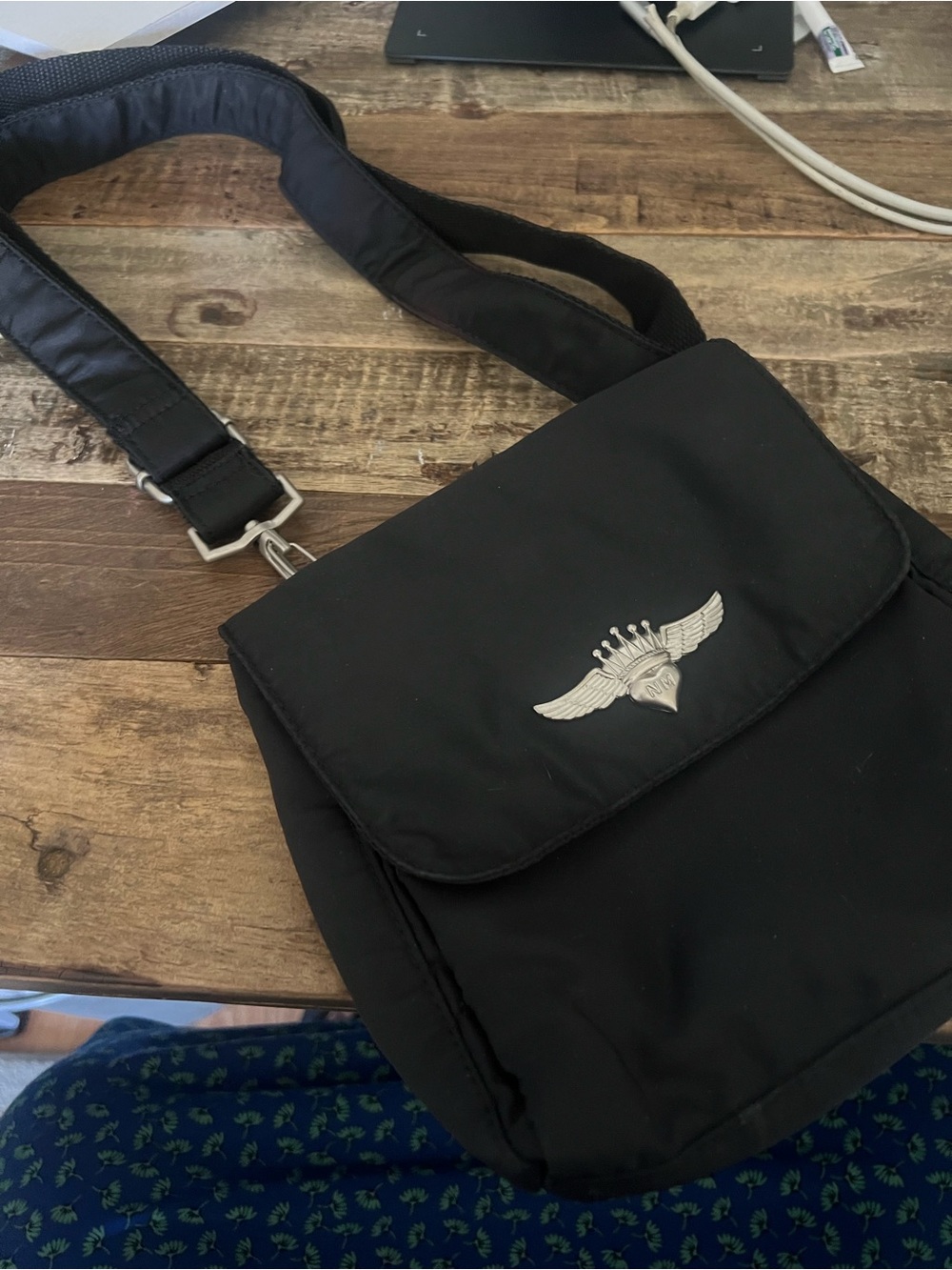 Black Crossbody Shoulder Bag with Winged Emblem by Nicole Miller